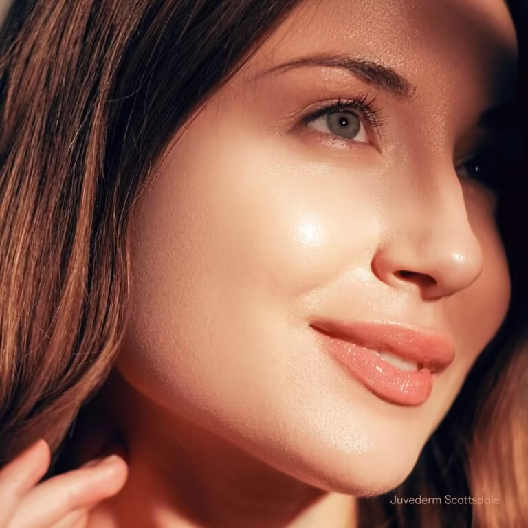 Woman showcasing natural results from Juvéderm filler treatment in Scottsdale